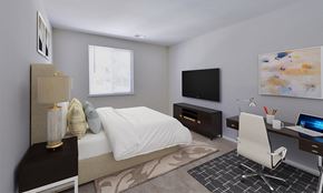 Parkville apartment for rent - a bedroom with a bed and a desk and a television