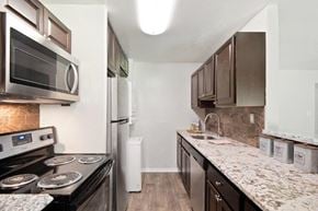 Parkville apartment for rent - a kitchen with granite counter tops and stainless steel appliances