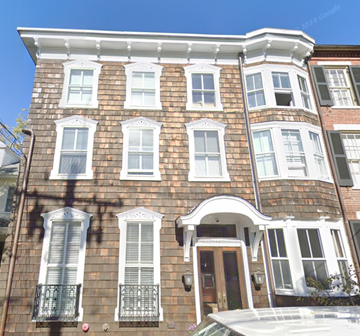 Annapolis apartment for rent - A brown brick house with white trim and windows.