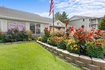 West Jordan apartment for rent - A garden in front of a house with a sign that says "The Stableberry".