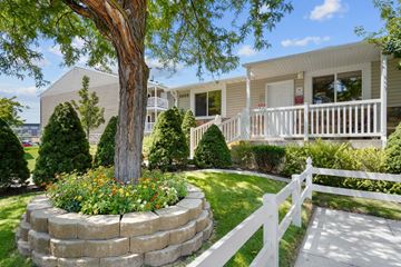 West Valley apartment for rent - A house with a white picket fence and a tree in front.