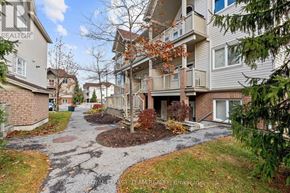 Ottawa condo for rent - A residential area with apartment buildings and a gravel pathway.