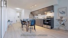 Toronto (West Hill) condo for rent - A modern kitchen with a dining table set for four.