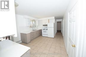 Waterloo duplex for rent - A bathroom with a tub, sink, toilet and mirror.