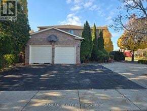 Oakville (Cv Clearview) house for rent - A house with a front yard and bushes.