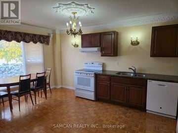 Oakville (Cv Clearview) house for rent - A kitchen with a table and chairs in front of a window.