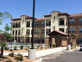 Colton apartment for rent - an apartment building with a pool in front of it