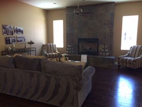 Colton apartment for rent - a living room with a couch and chairs and a fireplace