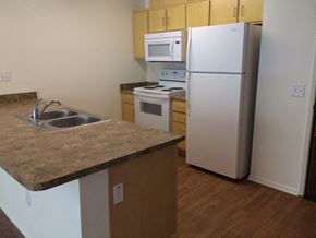 Colton apartment for rent - a kitchen with a sink and a refrigerator