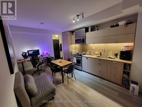Toronto (Waterfront Communities) condo for rent - A modern kitchen and living room area with a dining table and chairs.