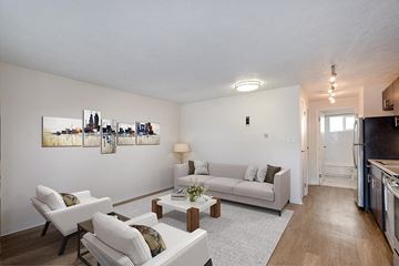 Denver apartment for rent - a living room with a couch and a table