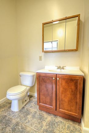 East Orange apartment for rent - Bathroom with wooden cabinets and white sink