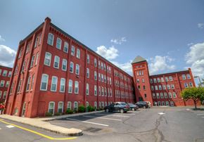 Newark apartment for rent - exterior view of building and parking lot