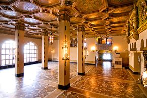 Little Rock apartment for rent - the lobby of a building with columns and a gold painted ceiling