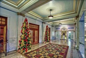 Little Rock apartment for rent - a large lobby with christmas trees and a door