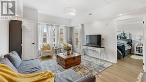 Lincoln (Lincoln-Jordan/Vineland) condo for rent - A well-lit, spacious bedroom with a large bed and a television.