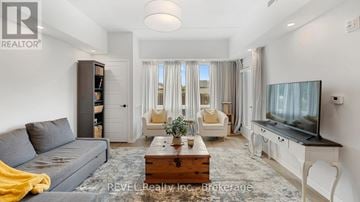 Lincoln (Lincoln-Jordan/Vineland) condo for rent - A living room with a grey couch and a wooden coffee table.