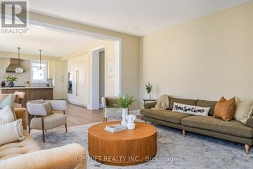 Blue Mountains house for rent - A well-lit living room with a brown sofa and a coffee table.