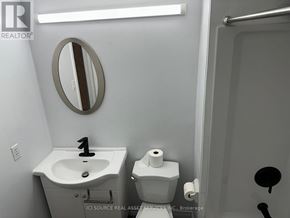 Toronto (Bridle Path-Sunnybrook-York Mills) house for rent - A bathroom with a sink, toilet and mirror.