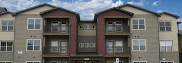 Cheyenne apartment for rent - Apartment building with balconies and multiple windows.