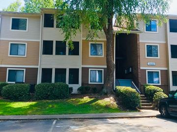 Lawrenceville apartment for rent - A brown and beige apartment building with the number 3420 on the front door.