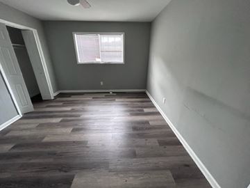 Mableton apartment for rent - A room with wooden flooring and a window.