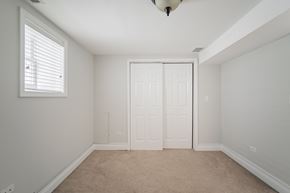 Chicago apartment for rent - an empty bedroom with a closet and a window