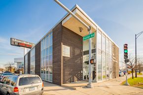 Chicago apartment for rent - the front of a building with cars parked in front of it