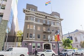 San Francisco apartment for rent - A building with a rainbow flag on top of it.