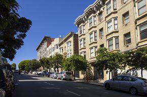San Francisco apartment for rent - A street view of a residential area with cars parked on the side of the road.