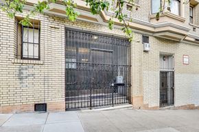 San Francisco apartment for rent - A black metal gate is on a brick wall.