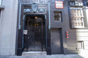 San Francisco apartment for rent - A building with a black door and a sign that says "Rent Now".