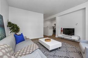 San Francisco apartment for rent - A living room with a grey couch and a white coffee table.