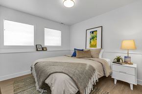 San Francisco apartment for rent - A bedroom with a bed, nightstand, and a painting on the wall.