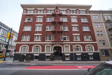 San Francisco apartment for rent - A red brick building with a fire escape on the side.