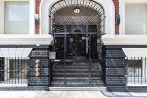 San Francisco apartment for rent - A black wrought iron gate with the name "Rex Arms" on it.