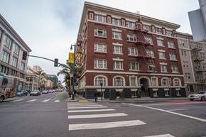 San Francisco apartment for rent - A large red brick building with a fire escape on the side.