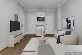 San Francisco apartment for rent - A living room with a television, a couch, and a coffee table.