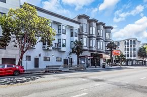 San Francisco apartment for rent - A red car is parked on the side of the street.