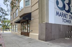 Harrisburg apartment for rent - a market street tower building with a sidewalk in front of it