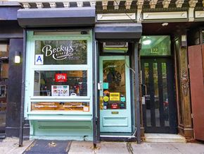 New York apartment for rent - the front of a store with a blue door