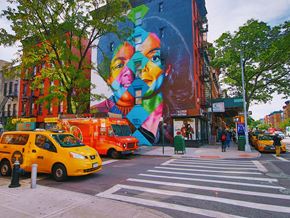 New York apartment for rent - a mural on the side of a building on a city street