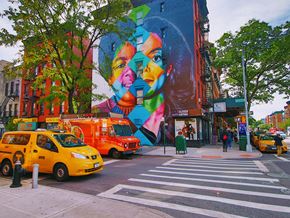 New York apartment for rent - a mural on the side of a building on a city street