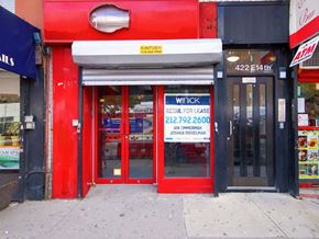 New York apartment for rent - the front of a restaurant with a sign on the door