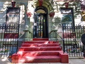 New York apartment for rent - a red staircase in front of a building