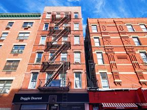 New York apartment for rent - a building with a fire escape on the side of it