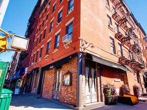 New York apartment for rent - a brick building on the corner of a street