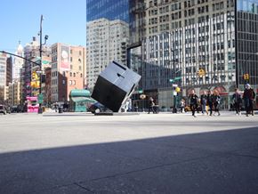 New York apartment for rent - a piece of furniture in the middle of a city street