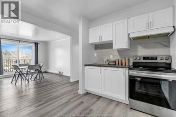 Windsor apartment for rent - A kitchen with white cabinets and a stainless steel oven.