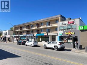 Windsor apartment for rent - A street view with cars parked and a building with a Share Tea sign.